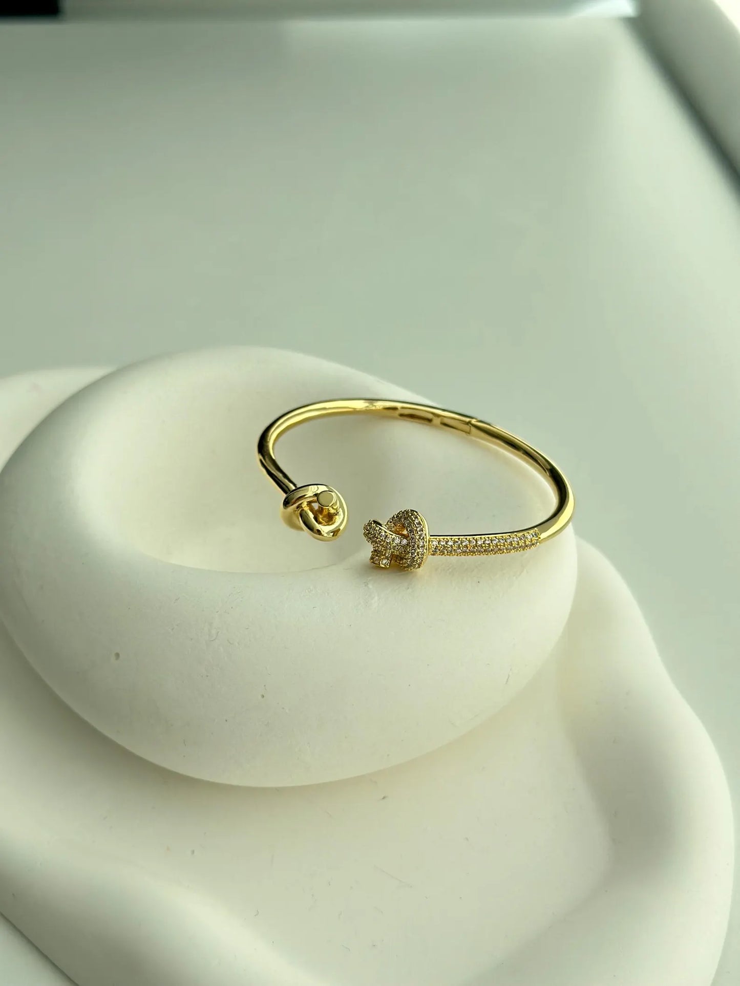 Twisted Intent – Gold Knotted Cuff Bracelet