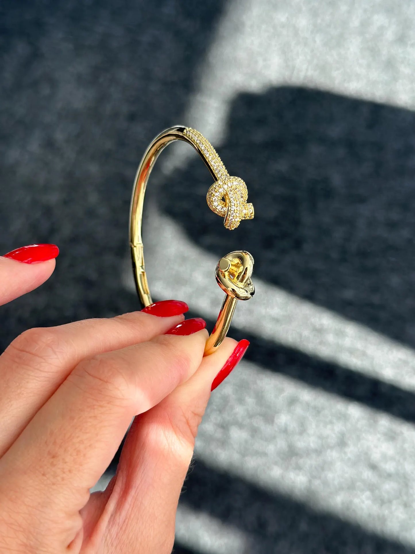 Twisted Intent – Gold Knotted Cuff Bracelet